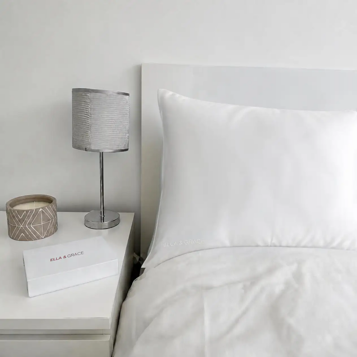 Ella & Grace Moonlight White Silk Pillowcase on Bed in a Bedroom Setting
