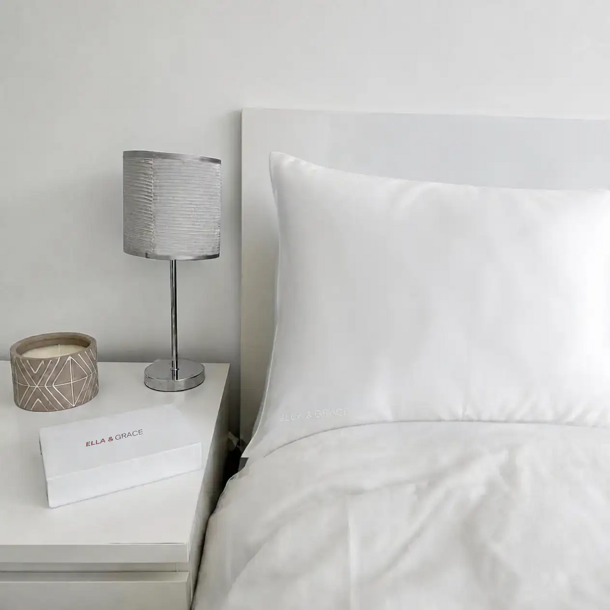 Ella & Grace Moonlight White Silk Pillowcase on Bed in a Bedroom Setting